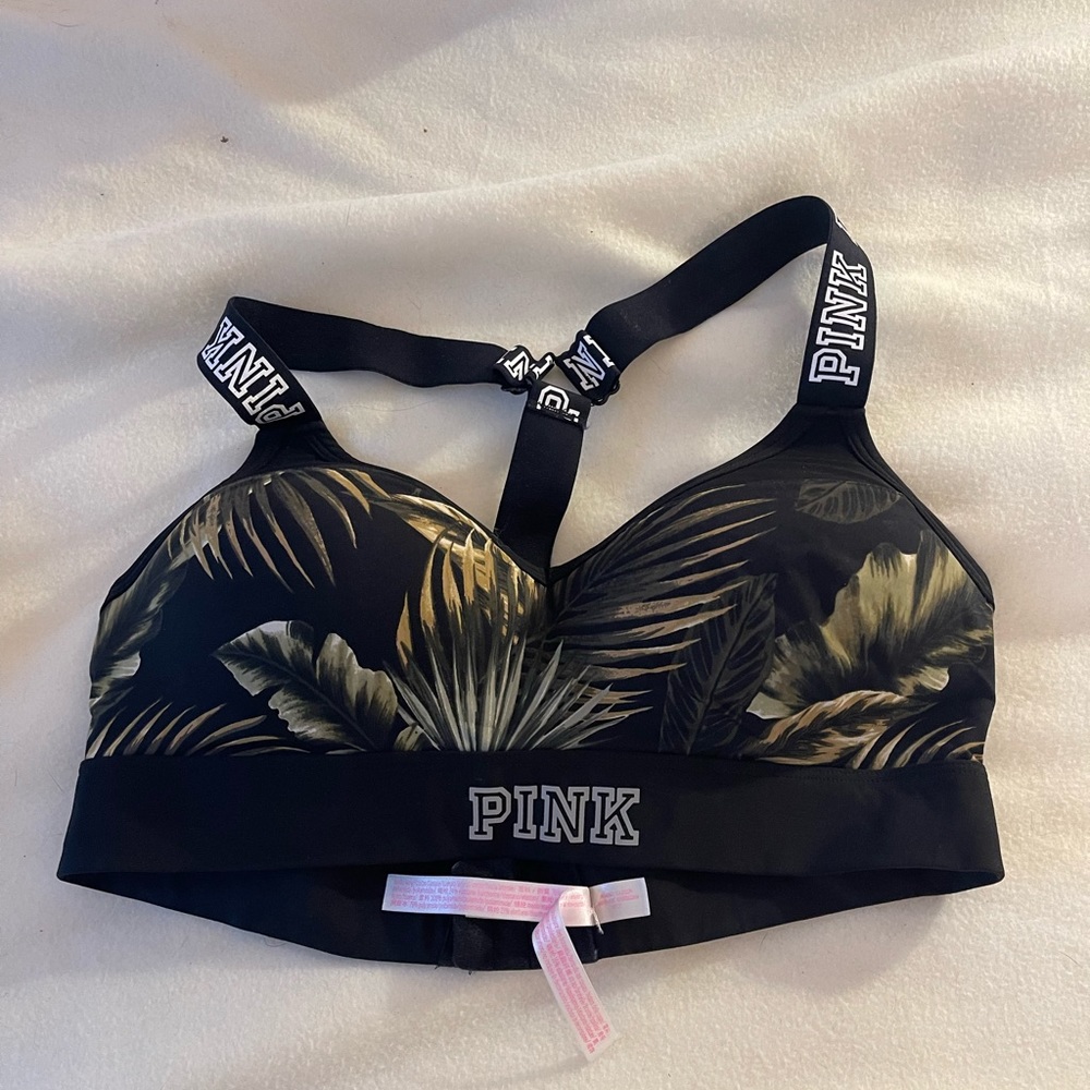 Pink sports bra with padding and adjusters